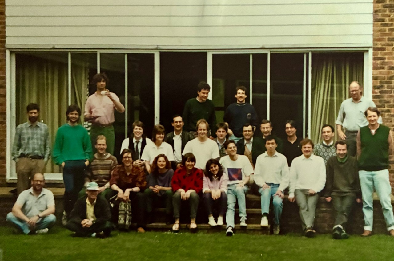 Inman is sitting on the grass, first on the left-hand side.