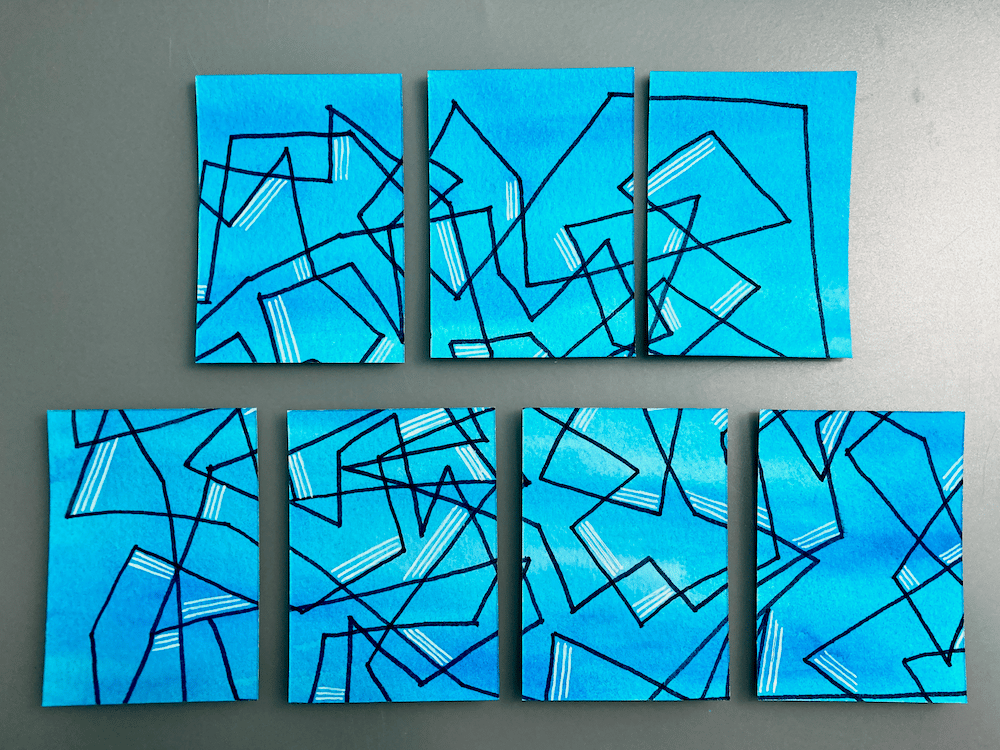 A series of cards with a blue background and abstract black and white lines.