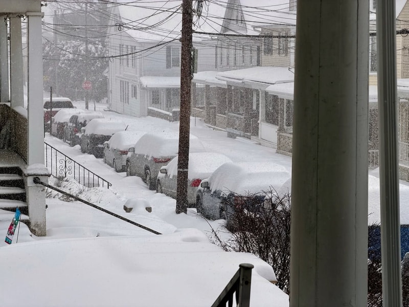 The snowy street out front